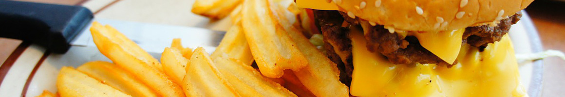 Eating Burger Hot Dog Pub Food at Twilley's Willys Hotdogs restaurant in Fenwick Island, DE.